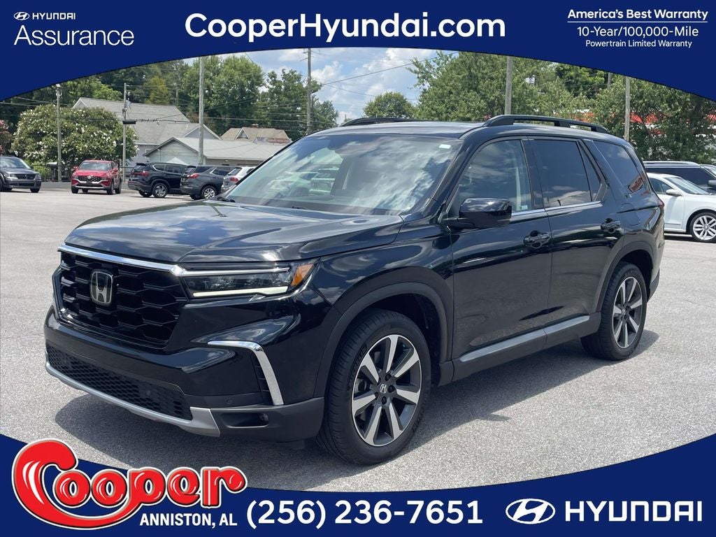2024 Honda Pilot Touring in Black — front three-quarter view