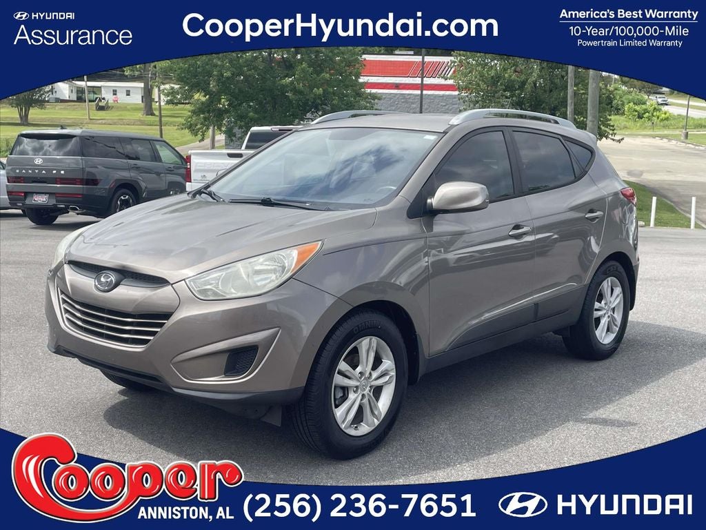2011 Hyundai TUCSON GLS in Chai Bronze — front three-quarter view